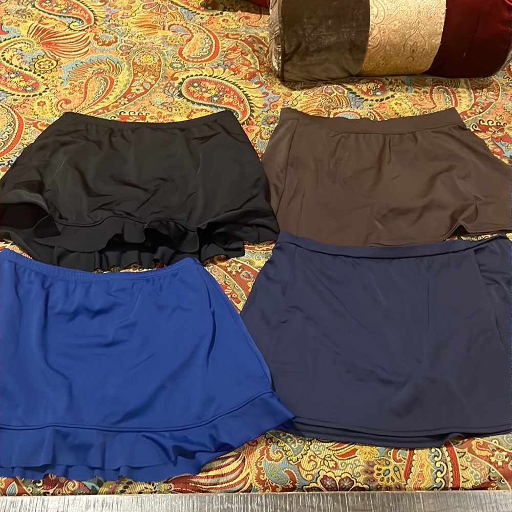 Lot.  4 Swim skirts. Excellent condition.